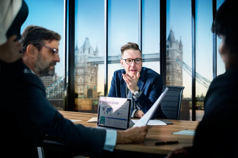 Underwriter meeting a broker in a city office